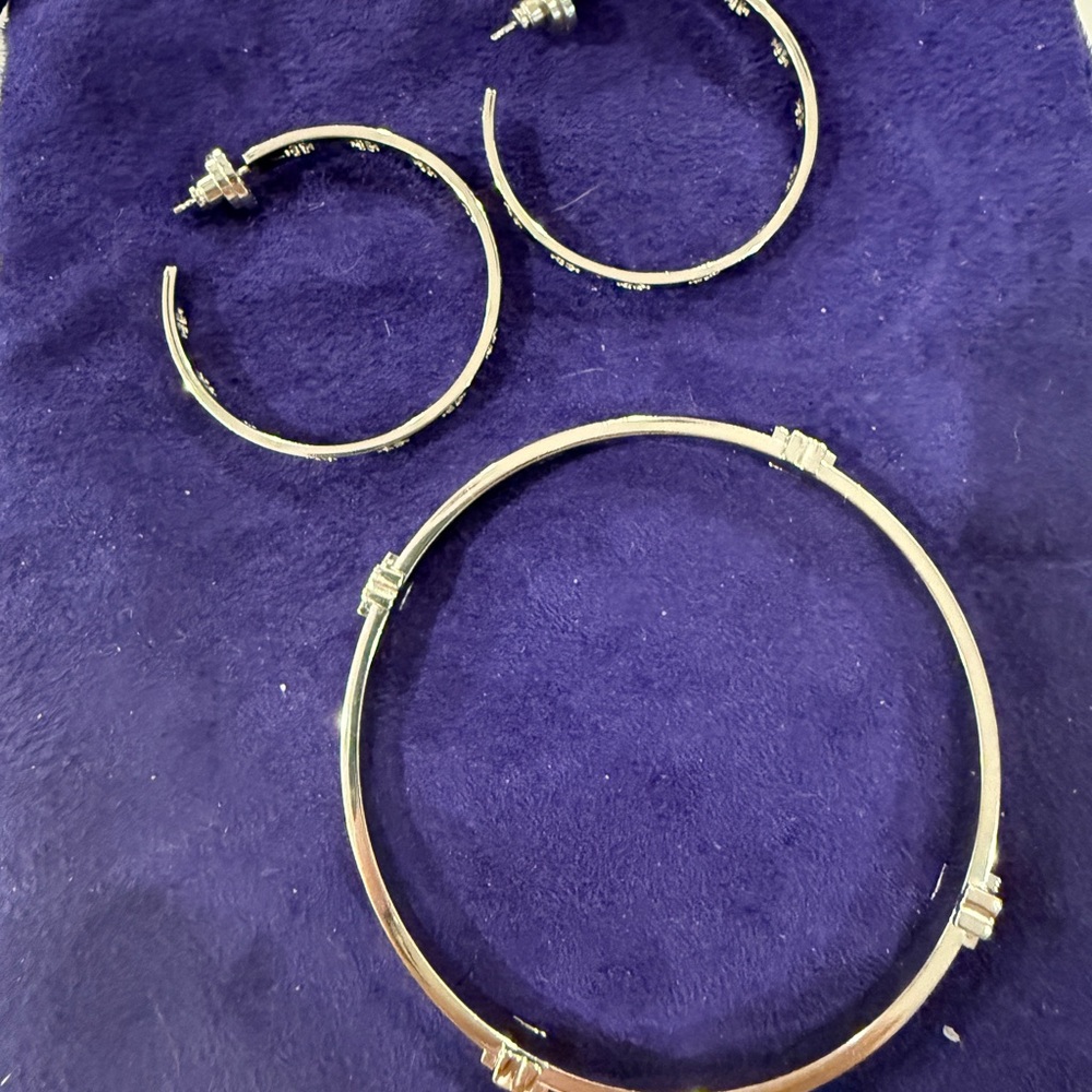 Tory Burch stainless steel bangle bracelet and pierced earrings.
